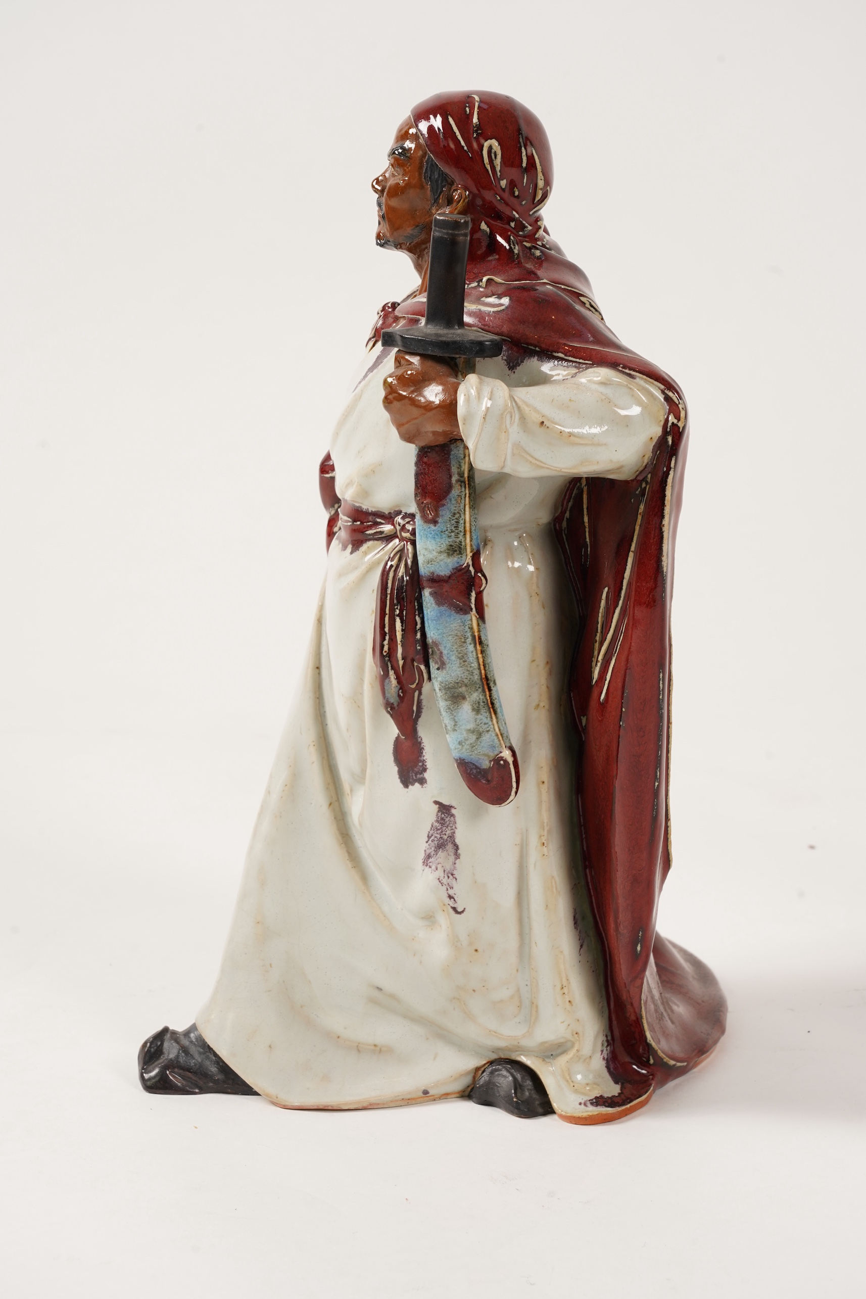 A large Chinese Shiwan stoneware figure of a warrior, 20th century